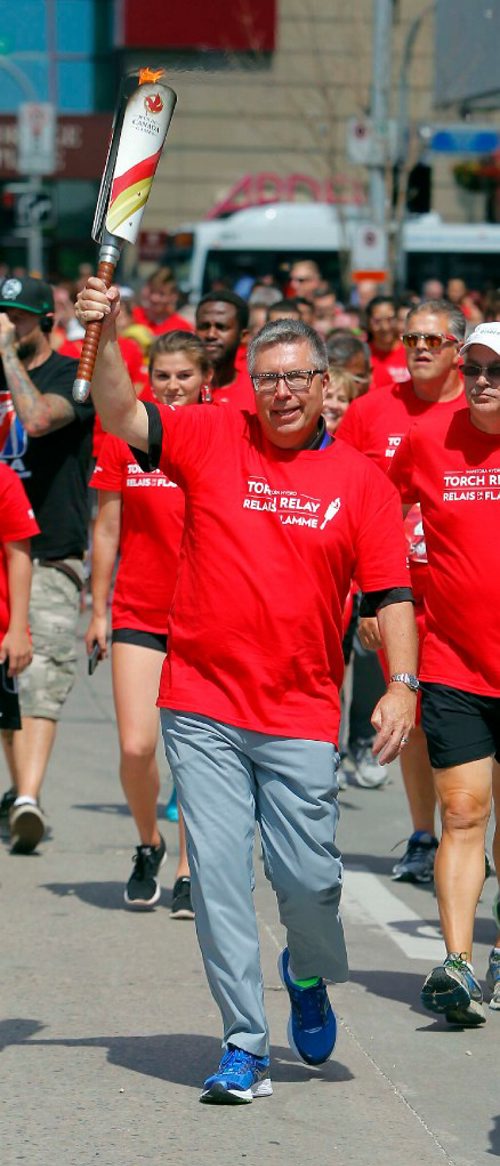 BORIS MINKEVICH / WINNIPEG FREE PRESS
2017 Canada Games torch relay photos. CEO of Manitoba Hydro Kelvin Shepherd is the last torchbearer that ended up at the celebration at the new Hydro building. July 26, 2017