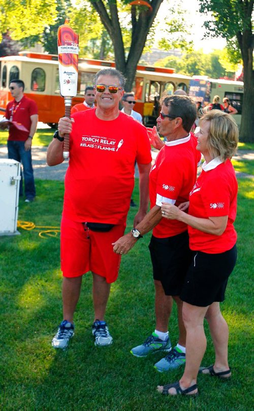 BORIS MINKEVICH / WINNIPEG FREE PRESS
2017 Canada Games torch relay photos. From left, Torchbearer 'Dancing Gabe' Langlois with Co-Chairs Hubert Mesman  and Mariette Mulaire at the start. July 26, 2017