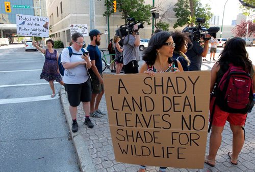 BORIS MINKEVICH / WINNIPEG FREE PRESS
Parkland protest at the Law Courts building today. Front holding the biggest sign Janice Pennington is part of the protest. July 26, 2017