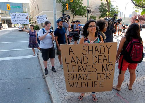 BORIS MINKEVICH / WINNIPEG FREE PRESS
Parkland protest at the Law Courts building today. Front holding the biggest sign Janice Pennington is part of the protest. July 26, 2017