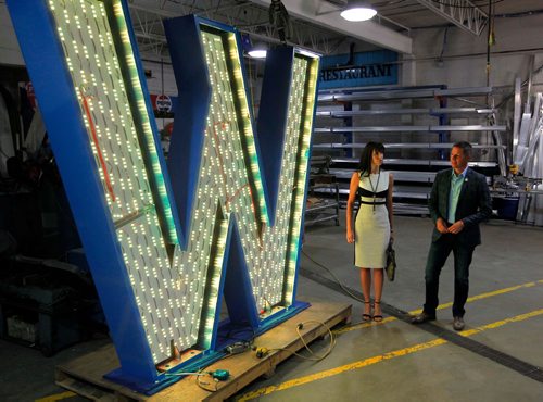 BORIS MINKEVICH / WINNIPEG FREE PRESS
From left, Dayna Spiring, President and CEO of Economic Development Winnipeg and Mayor Brian Bowman dropped by SRS Signs to get a close up look at the 'W' in the Winnipeg sign that is being installed at The Forks. The W is eight feet tall and seven feet wide.  July 27, 2017