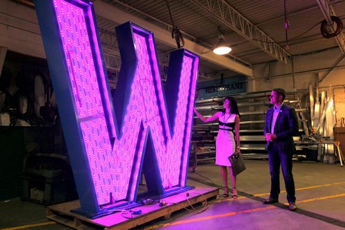 BORIS MINKEVICH / WINNIPEG FREE PRESS
From left, Dayna Spiring, President and CEO of Economic Development Winnipeg and Mayor Brian Bowman dropped by SRS Signs to get a close up look at the 'W' in the Winnipeg sign that is being installed at The Forks. The W is eight feet tall and seven feet wide.  July 27, 2017