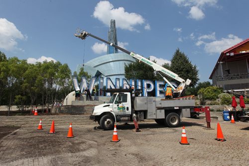 RUTH BONNEVILLE / WINNIPEG FREE PRESS

Employees with SRS signs place the letter W into position to spell the WINNIPEG in huge letters onto a platform next to Scotia Bank Stage at the Forks Thursday afternoon.  Mayor Brian Bowman was  on site for its placement at was ecstatic to see the letters get placed.   


 

July 27,, 2017