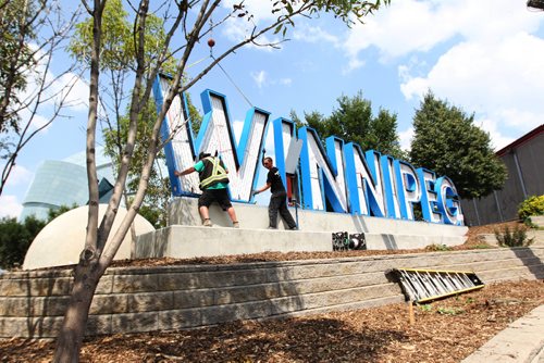 RUTH BONNEVILLE / WINNIPEG FREE PRESS

Employees with SRS signs place the letter W into position to spell the WINNIPEG in huge letters onto a platform next to Scotia Bank Stage at the Forks Thursday afternoon.  Mayor Brian Bowman was  on site for its placement at was ecstatic to see the letters get placed.   


 

July 27,, 2017