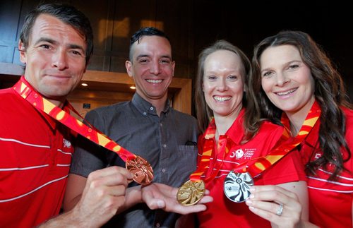 BORIS MINKEVICH / WINNIPEG FREE PRESS
2017 Canada Games medals. Shown off by from left, Adam Van Koeverden, Winnipeg artist who designed the medals Kenneth Lavallee, Manitoba's Olympian Cindy Klaassen, and Olympian Jennifer Botterill at an event this morning at the Manitoba Club. July 28, 2017