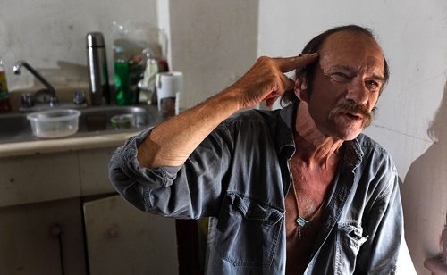 PHIL HOSSACK / WINNIPEG FREE PRESS - Mark Witt in his 2 room "suite" at a North End rooming house, gesturing while describing his fate since an assault left him in a coma, and now in failing health. See Mike McIntylre's story. - July 27, 2017