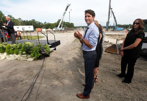 PHIL HOSSACK / WINNIPEG FREE PRESS  -  .Prime Minister Justin Trudeau and a member of his security team check out the crowd at the site of Canada's Diversity Gardens Saturday Morning. See Jane's story.   -  July 29, 2017