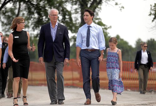 PHIL HOSSACK / WINNIPEG FREE PRESS  -  .Left to Right, Margaret Redmond and Hartley Richardson of the Assiniboine  Park Conservancy along with PM Justin Trudeau and his daughter Ella-Grace tour the future site of Canada's Diversity Gardens Saturday Morning.  -  July 29, 2017