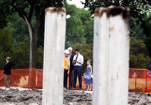PHIL HOSSACK / WINNIPEG FREE PRESS  -  .Left to Right, Mike Peters of Bird Construction, Margaret  Hartley Richardson of the Assiniboine  Park Conservancy along with PM Justin Trudeau and his daughter Ella-Grace tour the future site of Canada's Diversity Gardens Saturday Morning.  -  July 29, 2017