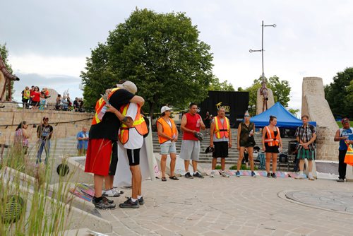 JUSTIN SAMANSKI-LANGILLE / WINNIPEG FREE PRESS
Members of a memorial group embrace Saturday after walking into the Forks Oodena Circle during the 9th annual No Stone Unturned benefit concert for Manitoba's murdered and missing. 
170729 - Saturday, July 29, 2017.