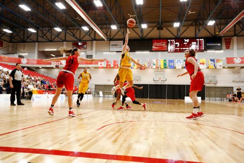 JUSTIN SAMANSKI-LANGILLE / WINNIPEG FREE PRESS
Team Manitoba's Lauren Bartlett goes airborne as Ontario's Julia Chadwick (L) attempts to block her shot during Saturday's women's basketball game.
170729 - Saturday, July 29, 2017.