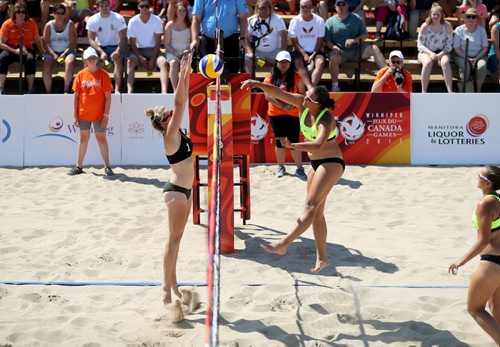 TREVOR HAGAN / WINNIPEG FREE PRESS
Team Manitoba's Kearley Abbott (1), right, hits passed New Brunswick's Madeleine Gorman-Asal (1) during beach volleyball action during the 2017 Canada Summer Games, Sunday, July 30, 2017.