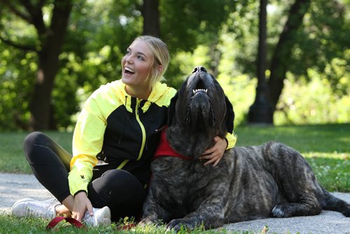 RUTH BONNEVILLE / WINNIPEG FREE PRESS

Pet visits planned to de-stress 2017 Games athetes
St. John Ambulance volunteers are ready to visit Athletes Village 


Canada Summer Games Team Manitoba softball athlete Shaye Kemball cuddles with Hank, a 7-year-old English Mastiff therapy dog at park along Waterfront Drive Monday morning.   St John Ambulance volunteers take their therapy dogs commonly visit hospitals, university campuses, airports, to a number of other events and venues, where stress levels can be elevated like  visiting Canada's best young athletes which is the first of its kind for the games.

See Ashley Prest story.  
July 31,, 2017