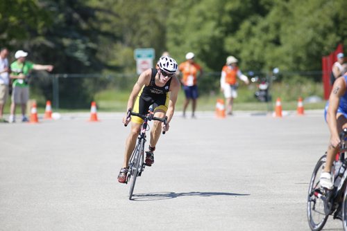 JUSTIN SAMANSKI-LANGILLE / WINNIPEG FREE PRESS
Manitoba athlete Adam Naylor rounds a bend in the cycling stage of Monday's mens triathlon at Birds Hill Park.
170731 - Monday, July 31, 2017.