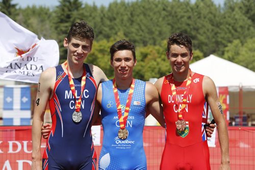 JUSTIN SAMANSKI-LANGILLE / WINNIPEG FREE PRESS
From left: B.C. athlete Michael Milic, Quebec athlete Paul-Alexandre Pavlos Antoniades and Ontarian Liam Donnelly pose atop the podium Monday during the medal ceremony for the women's triathlon at Birds Hill Park.
170731 - Monday, July 31, 2017.