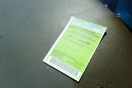 JUSTIN SAMANSKI-LANGILLE / WINNIPEG FREE PRESS
A Parks Manitoba vehicle day pass is seen on the dash of a car parked in Birds Hill Park Monday.
170731 - Monday, July 31, 2017.