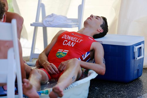 JUSTIN SAMANSKI-LANGILLE / WINNIPEG FREE PRESS
Team Ontario triathlete Liam Donnelly lays back as he cools off in a tub of water Monday after finishing the men's triathlon at Birds Hill Park
170731 - Monday, July 31, 2017.