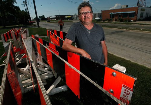 PHIL HOSSACK / WINNIPEG FREE PRESS  -   Rick Wagner poses in front of his St. Matthews ave Business Monday. The city is creating a bike lane in front of his business, eliminating parking for his clients. Kevin Rollason's story.   -  July 31, 2017