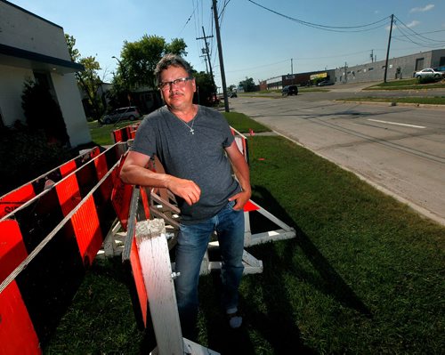 PHIL HOSSACK / WINNIPEG FREE PRESS  -   Rick Wagner poses in front of his St. Matthews ave Business Monday. The city is creating a bike lane in front of his business, eliminating parking for his clients. Kevin Rollason's story.   -  July 31, 2017