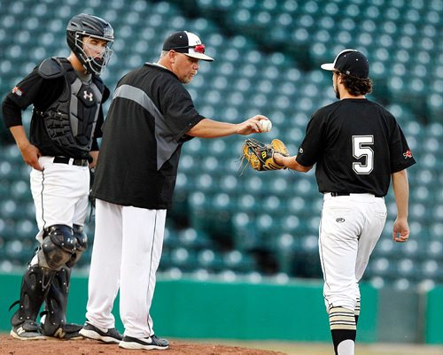 PHIL HOSSACK / WINNIPEG FREE PRESS  -   "Take that"...Team Manitoba pitcher  #5 Martin Gisiger is handed the game ball by ead coach Faron Asham as he came in to relieve #16 Kyle Dyck Monday night at Shaw Park. Catcher Jared McCorrister looks on . -  July 31, 201