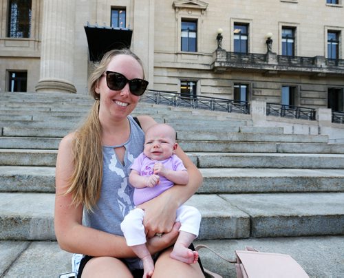 JUSTIN SAMANSKI-LANGILLE / WINNIPEG FREE PRESS
Robyn Liddle and her infant sit on the steps of the Manitoba Legislature during a demonstration against the Province's recent cuts to the Health Sciences Centre's Women's Hospital Lactation Consultant program.
170801 - Tuesday, August 01, 2017.