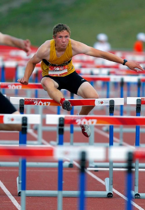 BORIS MINKEVICH / WINNIPEG FREE PRESS
Jackson Penner is from The Pas who is doing well in the Decathlon event. Here he competes in the 110m Hurdles. Track and field events held at the University of Manitoba Stadium. August 1, 2017