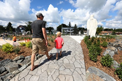 RUTH BONNEVILLE / WINNIPEG FREE PRESS

Gimli opens new space to house their giant statue of a Viking called Viking Park just prior to the Gimli Icelandic Festival this weekend.  
Six-year-old Bentley Gray and his dad Scott make their way toward the Viking statue in the newly created park Wednesday.  
See Ashley Prest story.  

  
July 28,, 2017