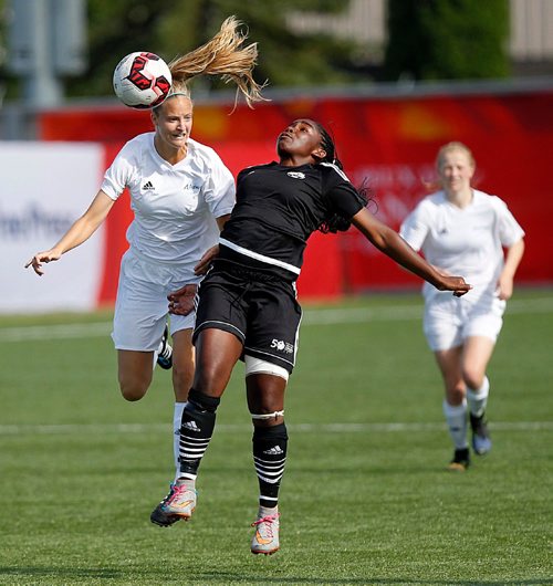 PHIL HOSSACK / WINNIPEG FREE PRESS  - Team Manitoba's #9 Jojo Ngongo (in black) collides with Team Alberta's #9  Brooke Lang heading the ball Tuesday in Canada Game Action, Taylor's story. .  - August 1, 2017