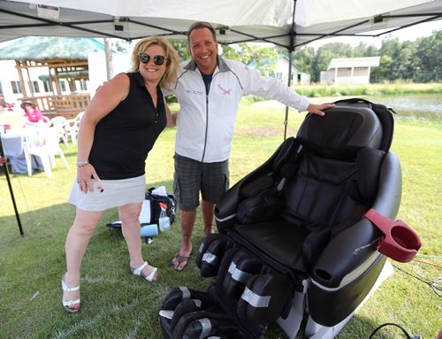 JASON HALSTEAD / WINNIPEG FREE PRESS

Gail Auriti (left), who was golfing with the Indigo Park foursome, heads back to her cart after trying out one of Clay Cracklens INADA massage chairs at the Brett Poncelet and La Salle Insurance and Travel Ltd. seventh annual Charity Golf Tournament in support of the Society for Manitobans with Disabilities (SMD) Foundation/Easter Seals Manitoba at Kingswood Golf and Country Club on July 26, 2017.(See Social Page)