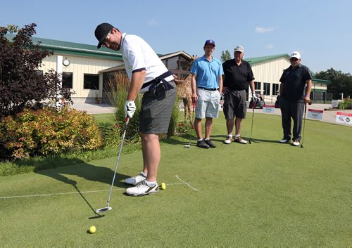 JASON HALSTEAD / WINNIPEG FREE PRESS

Stephen Gnutel takes part in the one-armed putting contest at the Brett Poncelet and La Salle Insurance and Travel Ltd. seventh annual Charity Golf Tournament in support of the Society for Manitobans with Disabilities (SMD) Foundation/Easter Seals Manitoba at Kingswood Golf and Country Club on July 26, 2017.(See Social Page)