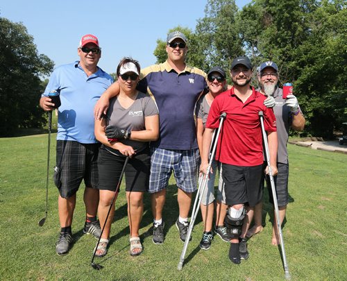 JASON HALSTEAD / WINNIPEG FREE PRESS

L-R: Keith Fitchet, Stacie Karlowsky, former Winnipeg Blue Bomber Brett MacNeil, Toni Brick, event co-organizer Brett Poncelet and Ken Brick enjoy the day as the MagicMen Hail Repair team took part in the Brett Poncelet and La Salle Insurance and Travel Ltd. seventh annual Charity Golf Tournament in support of the Society for Manitobans with Disabilities (SMD) Foundation/Easter Seals Manitoba at Kingswood Golf and Country Club on July 26, 2017.(See Social Page)