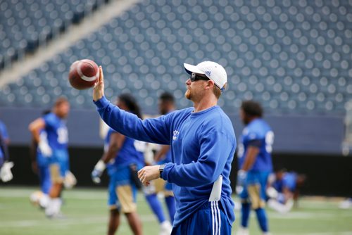 JUSTIN SAMANSKI-LANGILLE / WINNIPEG FREE PRESS
Bombers head coach Mike O'Shea catches the ball during warmup at Wednesday's practice at Investor's Group Field.
170802 - Wednesday, August 02, 2017.