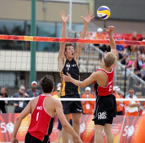 TREVOR HAGAN / WINNIPEG FREE PRESS
Team Manitoba's Dan Thiessen (2) tries to block Team British Columbias Isaac Bevis (2) during their beach volleyball match at Sargent Park, Wednesday, August 2, 2017.