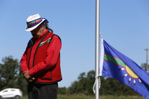 JUSTIN SAMANSKI-LANGILLE / WINNIPEG FREE PRESS
Elder Ernie Daniels of Long Plain First Nation bows his head during a prayer at a Treaty 1 flag raising ceremony Thursday at Lower Fort Gary National Historic Site.
170803 - Thursday, August 03, 2017.