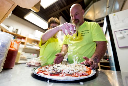 JUSTIN SAMANSKI-LANGILLE / WINNIPEG FREE PRESS
Jackie and Larry MacFarlane prepare a pizza Thursday at the Birds Hill Park campground store. The couple have started making and delivering pizzas to campers since they took over the property.
170803 - Thursday, August 03, 2017.