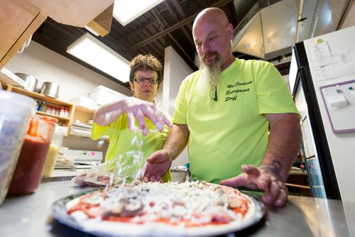 JUSTIN SAMANSKI-LANGILLE / WINNIPEG FREE PRESS
Jackie and Larry MacFarlane prepare a pizza Thursday at the Birds Hill Park campground store. The couple have started making and delivering pizzas to campers since they took over the property.
170803 - Thursday, August 03, 2017.