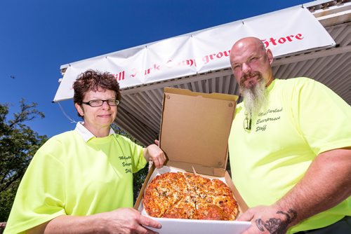 JUSTIN SAMANSKI-LANGILLE / WINNIPEG FREE PRESS
Jackie and Larry MacFarlane pose with a pizza Thursday at the Birds Hill Park campground store. The couple have started making and delivering pizzas to campers since they took over the property.
170803 - Thursday, August 03, 2017.