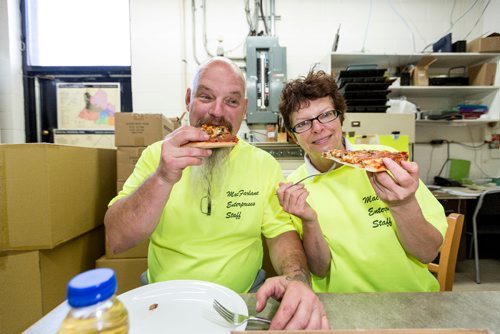 JUSTIN SAMANSKI-LANGILLE / WINNIPEG FREE PRESS
Larry and Jackie MacFarlane enjoy the fruit of their labour Thursday at the Birds Hill Park campground store. The couple have started making and delivering pizzas to campers since they took over the property.
170803 - Thursday, August 03, 2017.