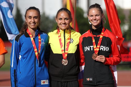 TREVOR HAGAN / WINNIPEG FREE PRESS
Flanked by Quebec's Audrey Jackson, bronze medalist, left, and Ontario's Katrina Innanen, silver medalist, Victoria Tachinski, middle, becomes the first Team Manitoba athlete to win a gold medal at the Canada Summer Games after winning the 400m race, Thursday, August, 3, 2017.