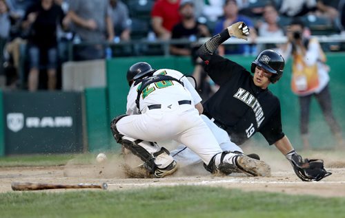 TREVOR HAGAN / WINNIPEG FREE PRESS
Team Saskatchewan's Brandon Logan can't stop the ball as Team Manitoba's Jon Patmore slides into home, Friday, August, 4, 2017.