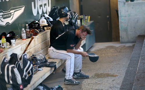 TREVOR HAGAN / WINNIPEG FREE PRESS
Team Manitoba's Tristan Peters sits in the dugout after getting called out while playing against Saskatchewan for baseball gold at the summer games, Friday, August, 4, 2017.