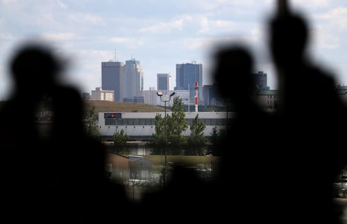 TREVOR HAGAN / WINNIPEG FREE PRESS
With downtown in the background, Team Quebec athletes depart the airport after week one of the Canada Summer Games, Saturday, August, 5, 2017.