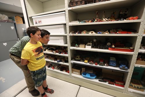 TREVOR HAGAN / WINNIPEG FREE PRESS
Gerald Heckman and his son, Paul, 11, looking at shelves of toys that are artifacts in the archives at the Manitoba Museum, Friday, August, 4, 2017.