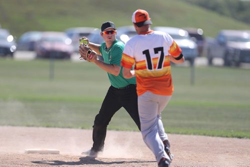 TREVOR HAGAN / WINNIPEG FREE PRESS
Matt Forsythe, of the Pitch Slappers, from Abbotsford, BC, turns a double play as Joel Stevens, of the Prides Thunder from Swift Current, Saskatchewan, tries to run to second base during Slow Pitch Nationals at Little Mountain Sportsplex, Sunday, August 6, 2017.