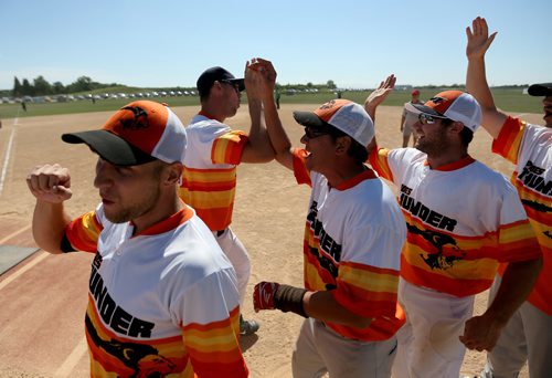 TREVOR HAGAN / WINNIPEG FREE PRESS
Second from left, Lane Scherger of the Prides Thunder from Swift Current, Saskatchewan, celebrates his extra innings walk off home run against the Pitch Slappers, from Abbotsford, BC during Slow Pitch Nationals at Little Mountain Sportsplex, Sunday, August 6, 2017.