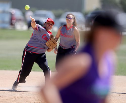 TREVOR HAGAN / WINNIPEG FREE PRESS
Christine Lessard of the Laiterie de Coaticook, from Sherbrooke, QC, throws to first base while playing against the Manitoba Misfits during Slow Pitch Nationals at Little Mountain Sportsplex, Sunday, August 6, 2017.