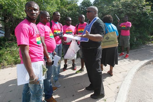 JOHN WOODS / WINNIPEG FREE PRESS
Caribbean pavillion organizer tells Ghana protestors that they must protest on the sidewalk Sunday, August 6, 2017. The protestors were gathering signatures against the Ghanaian government's anti-LGBTQ policy