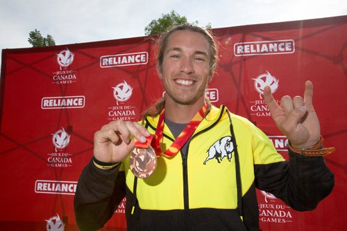 JUSTIN SAMANSKI-LANGILLE / WINNIPEG FREE PRESS
Team Manitoba's James Lavallée poses with his medal Monday after completing his races at the Manitoba Canoe and Kayak Centre.
170807 - Monday, August 07, 2017.