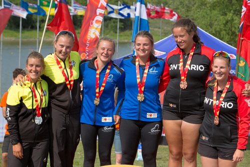 JUSTIN SAMANSKI-LANGILLE / WINNIPEG FREE PRESS
Maddy Mitchell and Nicole Boyle, MB., Sophia Jensen and Juliette Brault, QC. and Lindsay Irwin and Emily Howard, ON stand on the podium with their medals Monday at the Manitoba Canoe and Kayak Centre.
170807 - Monday, August 07, 2017.