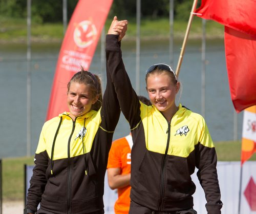 JUSTIN SAMANSKI-LANGILLE / WINNIPEG FREE PRESS
Team Manitoba's Maddy Mitchell (L) and Nicole Boyle step up to the podium Monday during the medals ceremony at the Manitoba Canoe and Kayak Centre.
170807 - Monday, August 07, 2017.